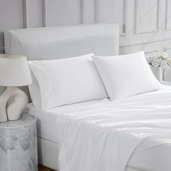 White percale bed sheets and pillow covers on a bed