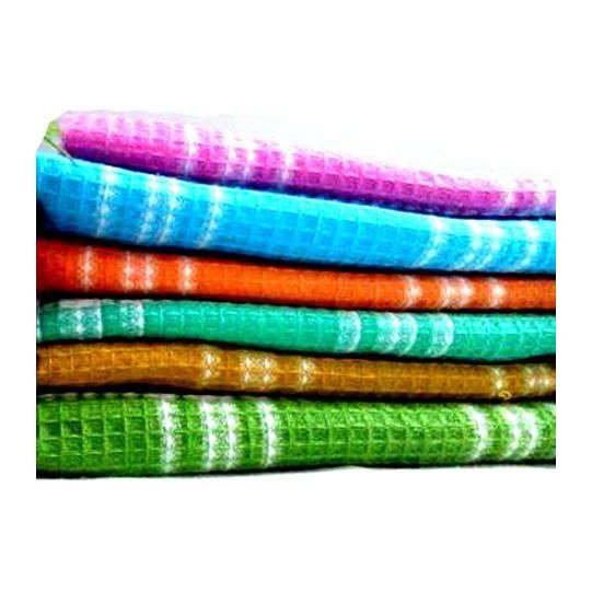 Stack of honeycomb towels in six colours